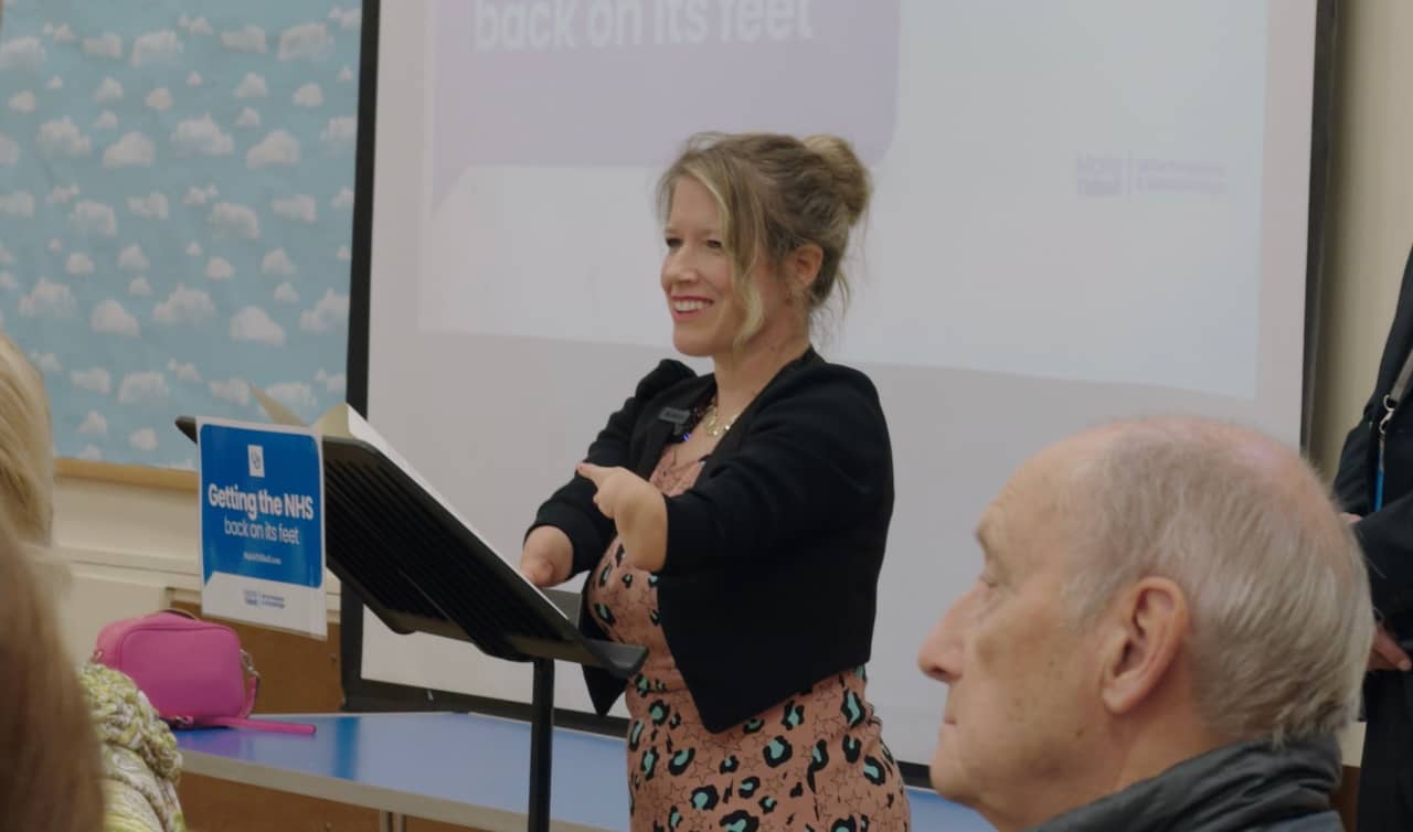 Marie Tidball at podium