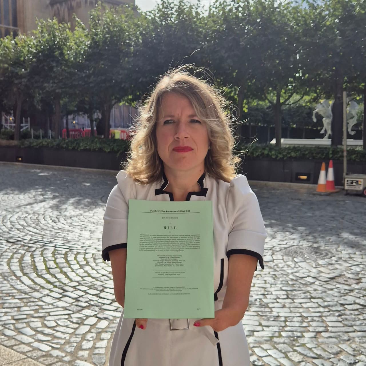 Marie Tidball MP with a copy of the draft Hillsborough Law