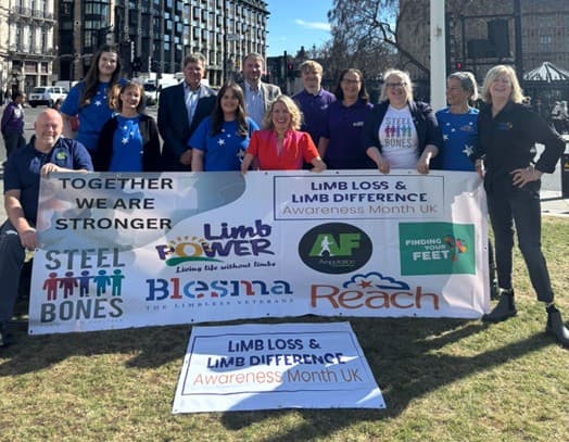 Marie Tidball MP with members of the Limb Loss and Limb Difference Alliance outside Parliament